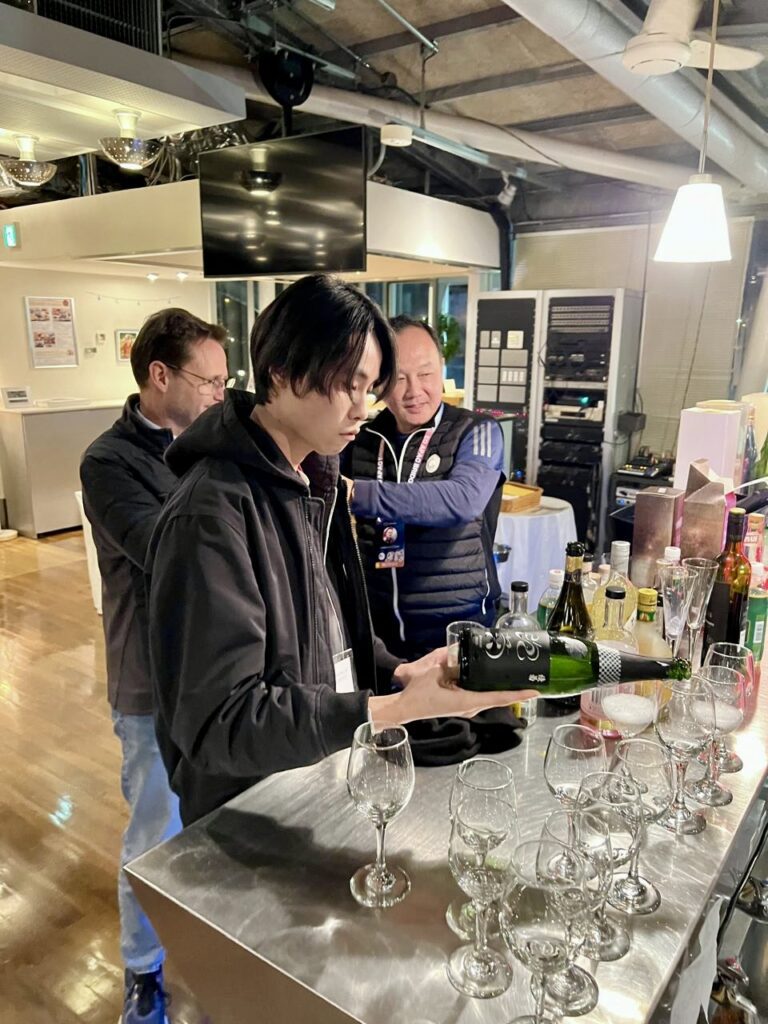 Guest pouring Sake at Sake Club India event in Japan