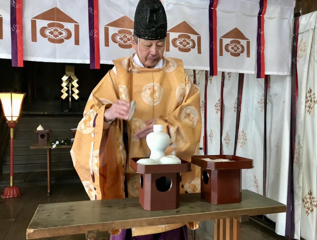 Sake offering at Daisuke Shinto shrine.