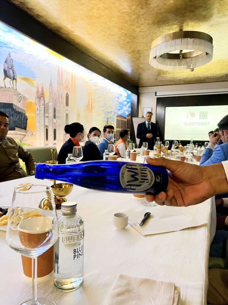 hakutsuru awayuki sparkling sake being served at a sake club india training